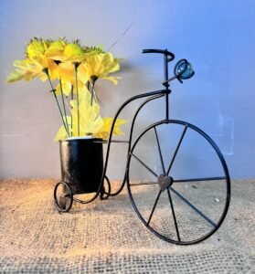 Black Metal Cycle with yellow sun flowers