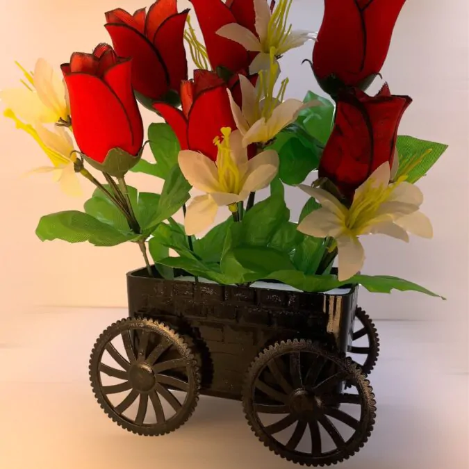 Vibrant Red Blooms in Charming Trolley Planter