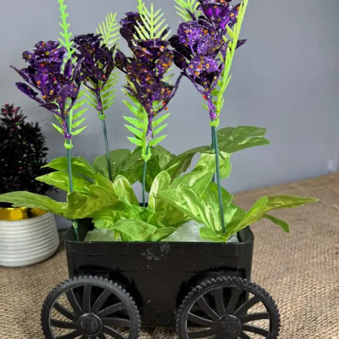 Black trolley and purple flowers