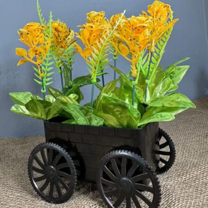 Black trolley with yellow flower