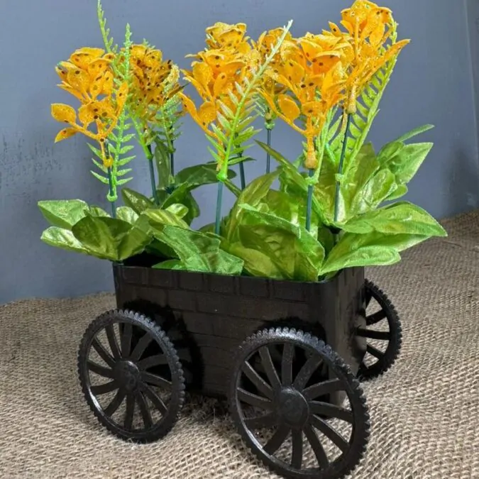 Black trolley with yellow flower